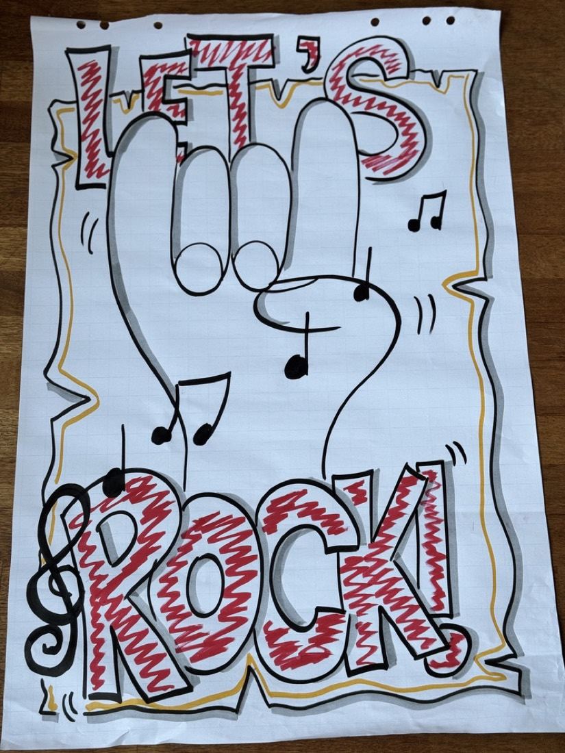 Flipover met Let's Rock in rode bubbelletters en muzieknoten.